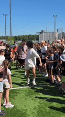 Community fitness class draws dozens to Mytishchi sports field