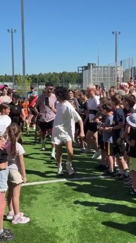 Community fitness class draws dozens to Mytishchi sports field