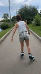 Rollerblading through a shaded park path in Irkutsk