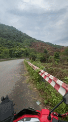 Motorcyclist documents roadside stop in rural Khanh Vinh Vietnam