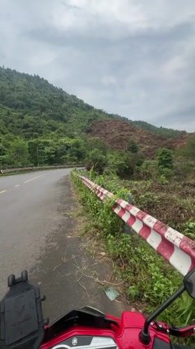 Motorcyclist documents roadside stop in rural Khanh Vinh Vietnam