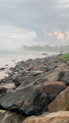 Beachgoers recorded walking Kathaluwa shores under cloudy skies