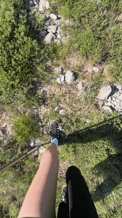 Hikers traverse mountain trails in Montenegro under sunny skies