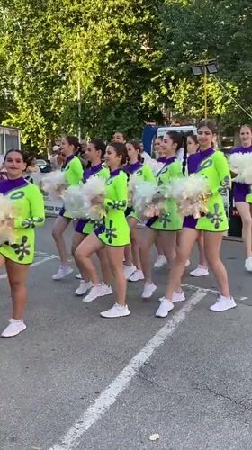 Cheerleaders and strongman athletes share the streets of Pleven