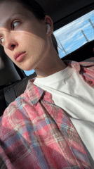 Woman observed relaxing in car with earbuds in Moscow