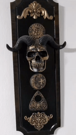 Ornate black and gold wall decoration documented in Barcelona