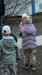 Toddlers play with bubbles outdoors in Moscow