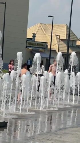 Children enjoy sunny day at Dmitrov fountain and square