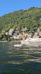 Sunny afternoon boat activity documented across Lake Como waterfront