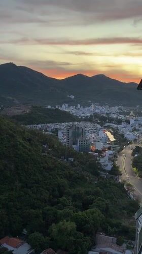 Nha Trang at golden hour, mountains meeting the coast