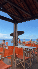 Leisurely morning at oceanfront restaurant and promenade in Funchal