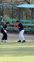 Young men practice boxing on outdoor court in Russia