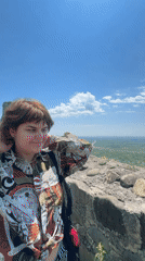 Visitors explore scenic hilltop overlook in Manavi, Georgia