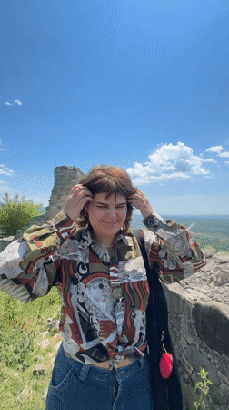 Visitors explore scenic hilltop overlook in Manavi, Georgia