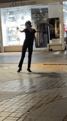 Dancing on a Sofia sidewalk, with a cat nearby