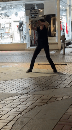 Dancing on a Sofia sidewalk, with a cat nearby