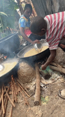 Open-fire cooking with large pots in Badagry, Nigeria