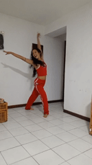 Woman performs acrobatic dance routine in Porlamar home