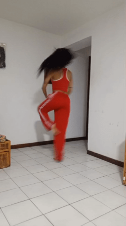 Woman performs acrobatic dance routine in Porlamar home