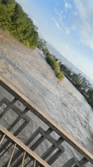 Muddy Mtkvari River flows rapidly through Tbilisi, Georgia