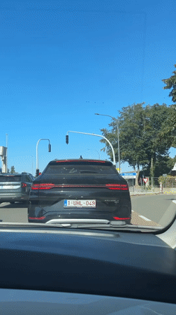 Slow afternoon drive past Bruges' windmills and medieval gate