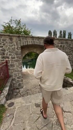 Tourist explores historic Trebinje mosques and architecture during afternoon walk