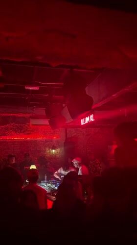 A night at a Kuala Lumpur club, red lights and all.