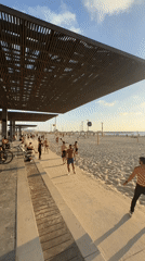 Tel Aviv afternoon scenes: sunset beach, storefront reflection captured