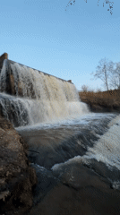 Russian dam waterfall documented during evening hours near Kamennoye