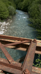 Rusted bridge components documented over river in Montenegro