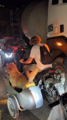 Motorcyclist caught in nighttime traffic congestion in Kuta Selatan