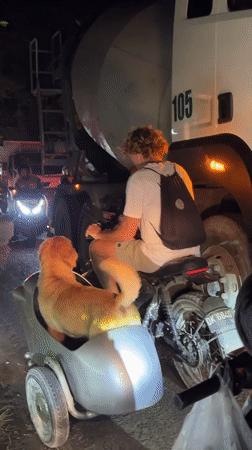 Motorcyclist caught in nighttime traffic congestion in Kuta Selatan