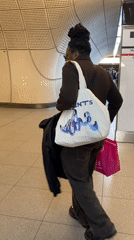 Commuter walks through London Underground tunnel Thursday evening