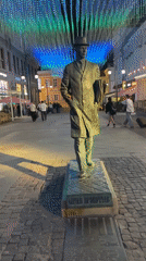 Evening street scenes captured near Prokofiev statue in Moscow