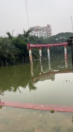 Toy vendor blows bubbles at a waterlogged Ramna Park