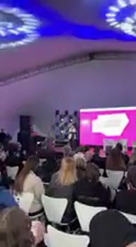 Woman presents "Journey to Ukraine" conference in Kyiv