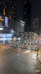 Heavy traffic captured at Bangkok intersection during nighttime