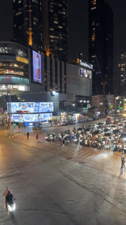 Heavy traffic captured at Bangkok intersection during nighttime