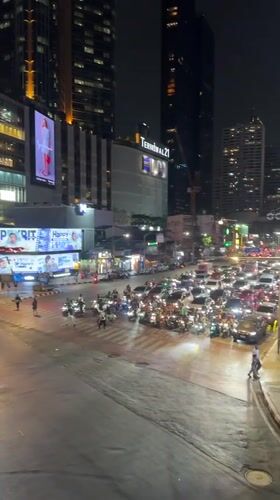 Heavy traffic captured at Bangkok intersection during nighttime