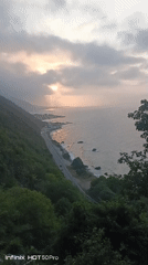 Sunset bonfire at a decorated coastal spot in El Tigrillo
