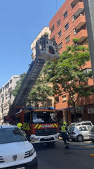 Valencia firefighters battle building fire with aerial ladder operations