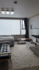 Sparse apartment interior documented in Seoul morning