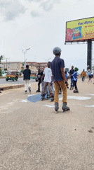 Youth inline skating group practices coordinated movements in Jos