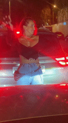 Woman dances, poses on Moscow street at midnight