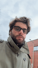 Squirrel feeding and man in trench coat captured in Montreal