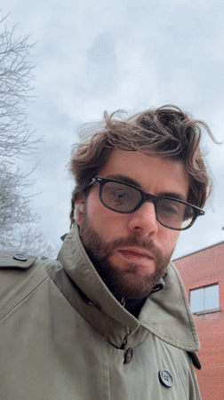 Squirrel feeding and man in trench coat captured in Montreal