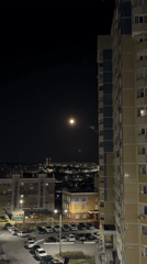 Full moon illuminates Cheboksary cityscape on May evening