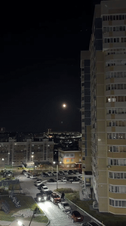 Full moon illuminates Cheboksary cityscape on May evening