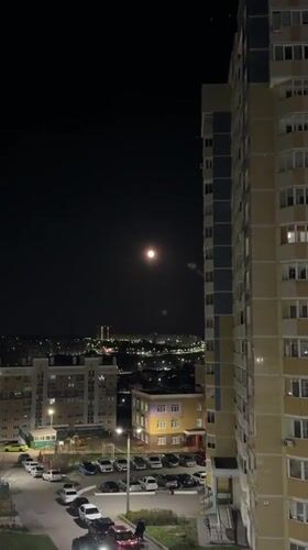 Full moon illuminates Cheboksary cityscape on May evening