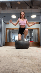 Woman uses exercise ball in Krasnoyarsk retail fitting area